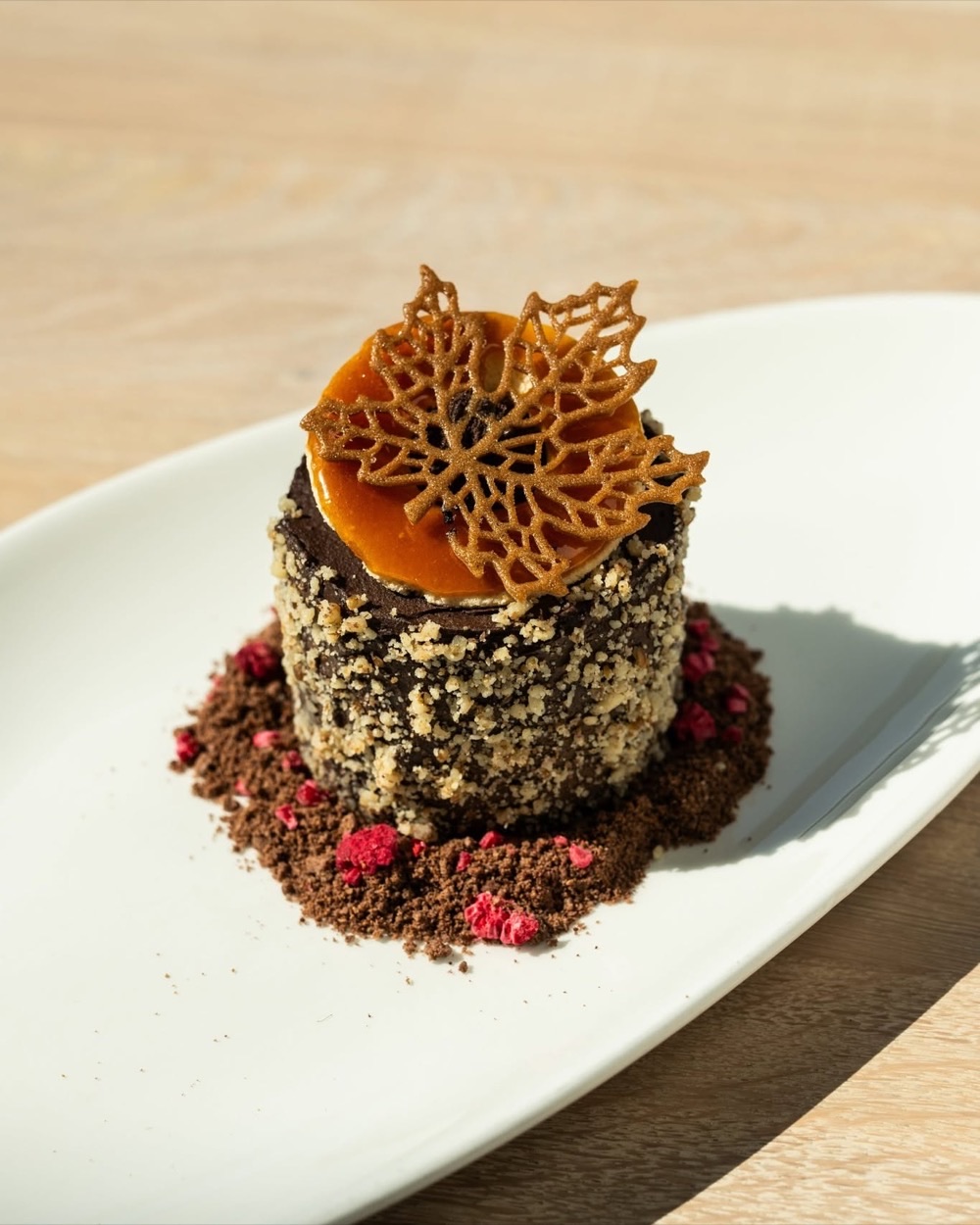 Dobos cake in a modern presentation with a caramel tuile