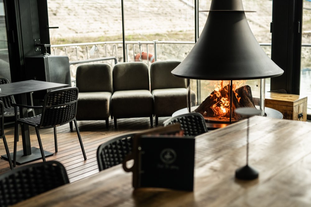 The wood-burning fireplace in the deck space