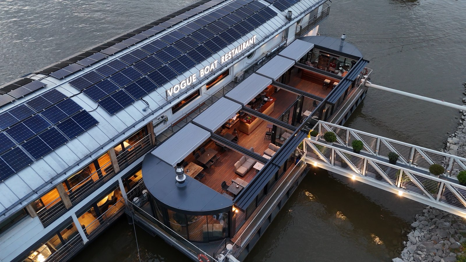 The boat's pavilion and gangway from above at dusk