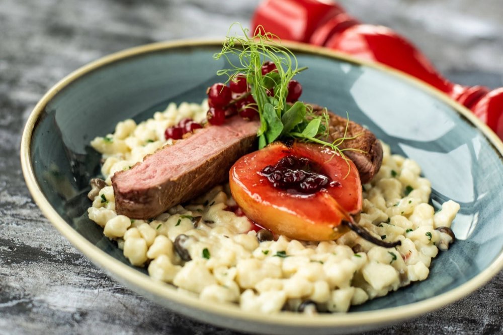 Rosé duck breast with dumplings and fruit sauce